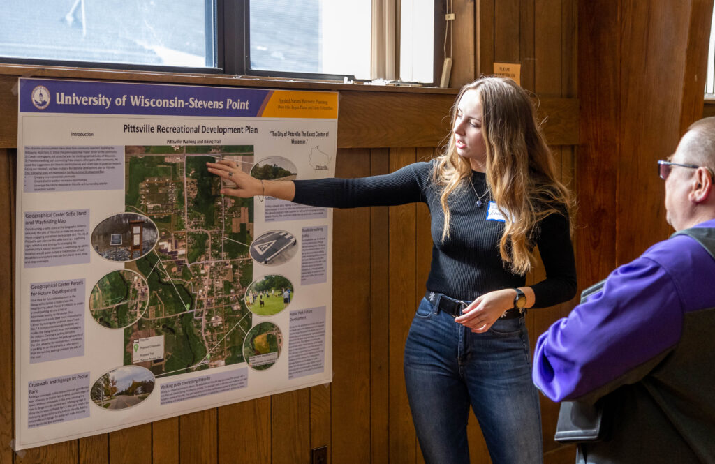 Student presenting poster