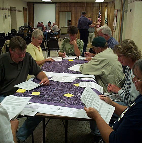 Group working together to read papers