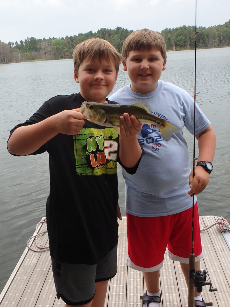 Campers holding a fish