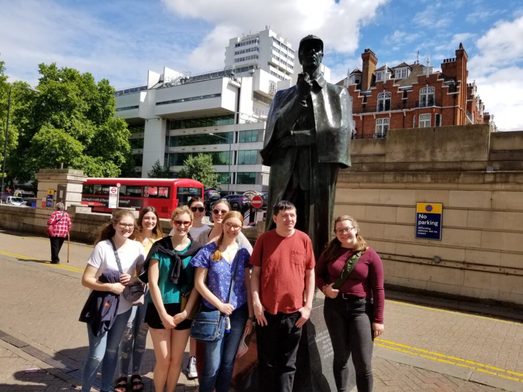 Group of 8 UWSP students standing in London street during summer study abroad trip.