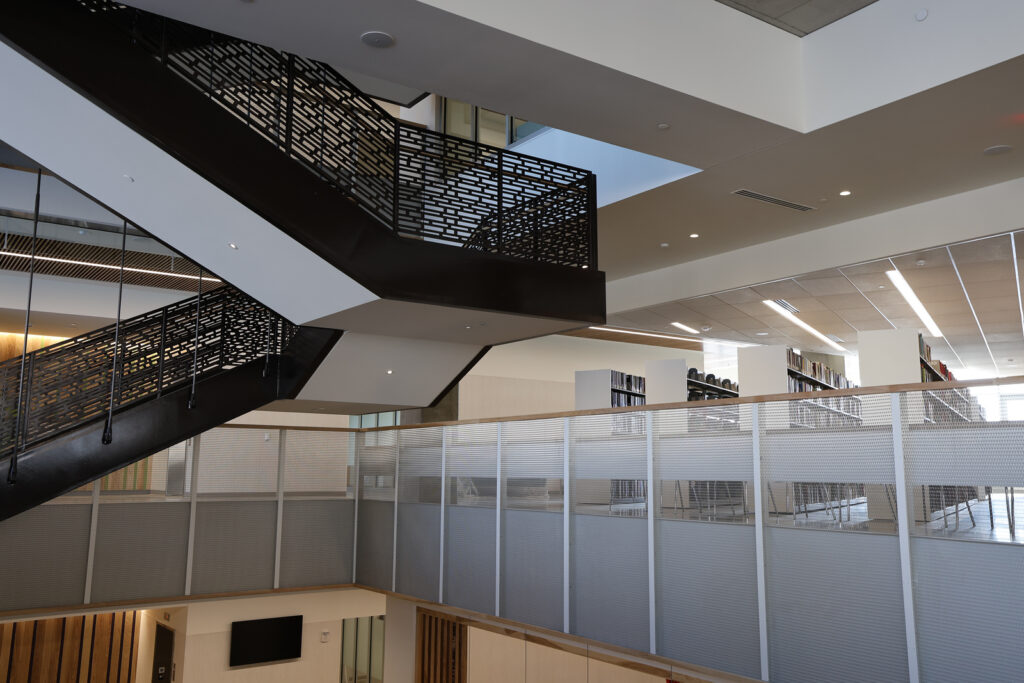 Stairwell and floor with books inside the Library and Student Resource Center