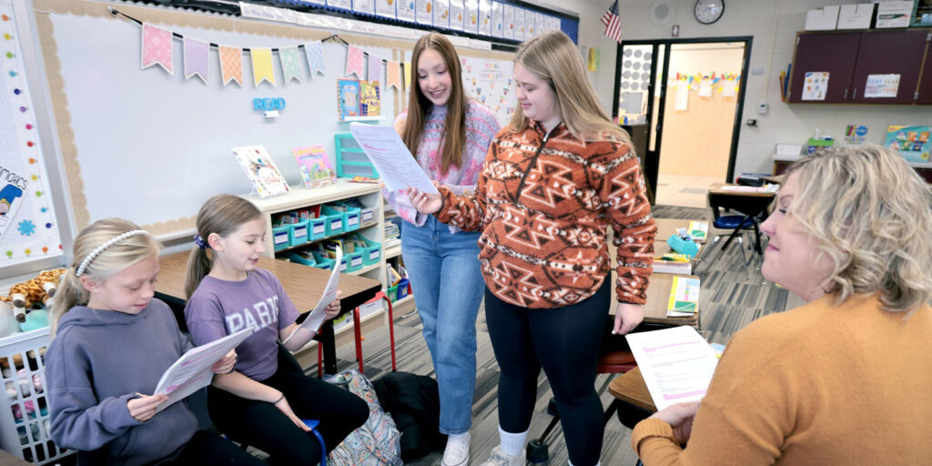 Students work in pairs on vocabulary cards during a literacy lesson.