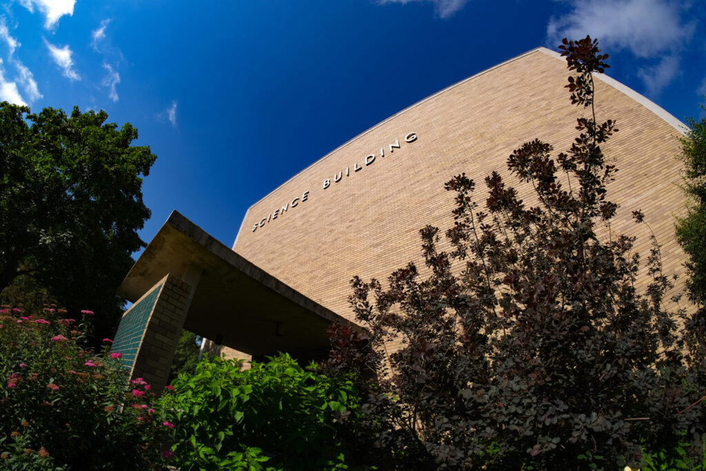 The Science Building exterior building with blue sky background.