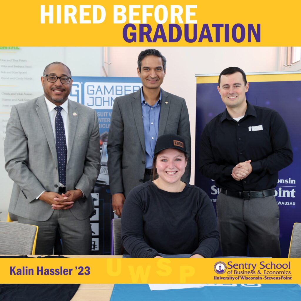 Group photo with four people standing and one seated with the text “Hired Before Graduation” and “Kalin Hassler ’23” for the Sentry School of Business & Economics