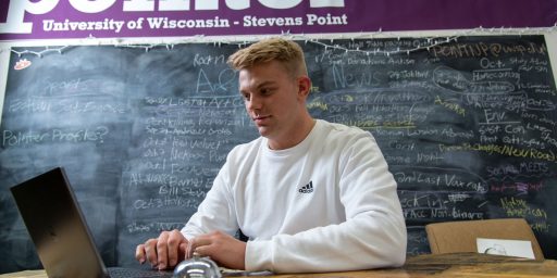 UWSP Student in Newspaper Office