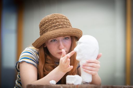 UWSP Student working with clay.