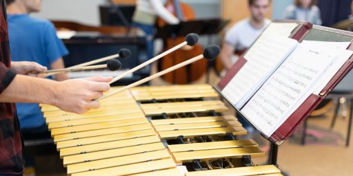 Music Student playing xylophone