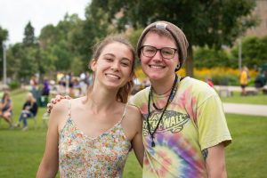 Two female students smiling for the camera during Welcome Week event.