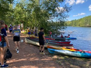 Group of students getting ready to kayak on Lake Joanis.