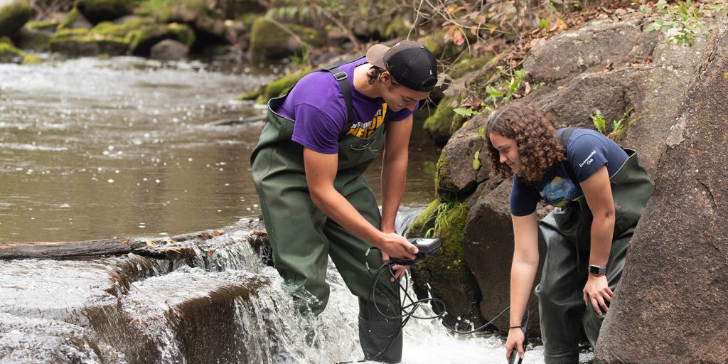 Students in the water with a fisheries class