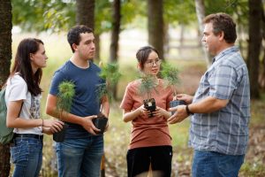 Forestry students and professor learning about trees in Schmeeckle Reserve.