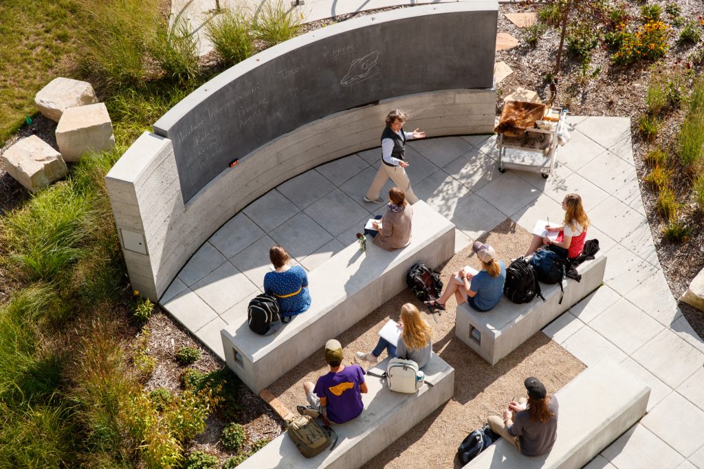 Natural Resources students and professor teaching outside of the Chemistry Biology Building