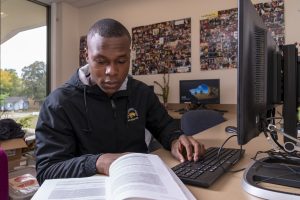 Student working on a computer in the Multicultural Resource Center.
