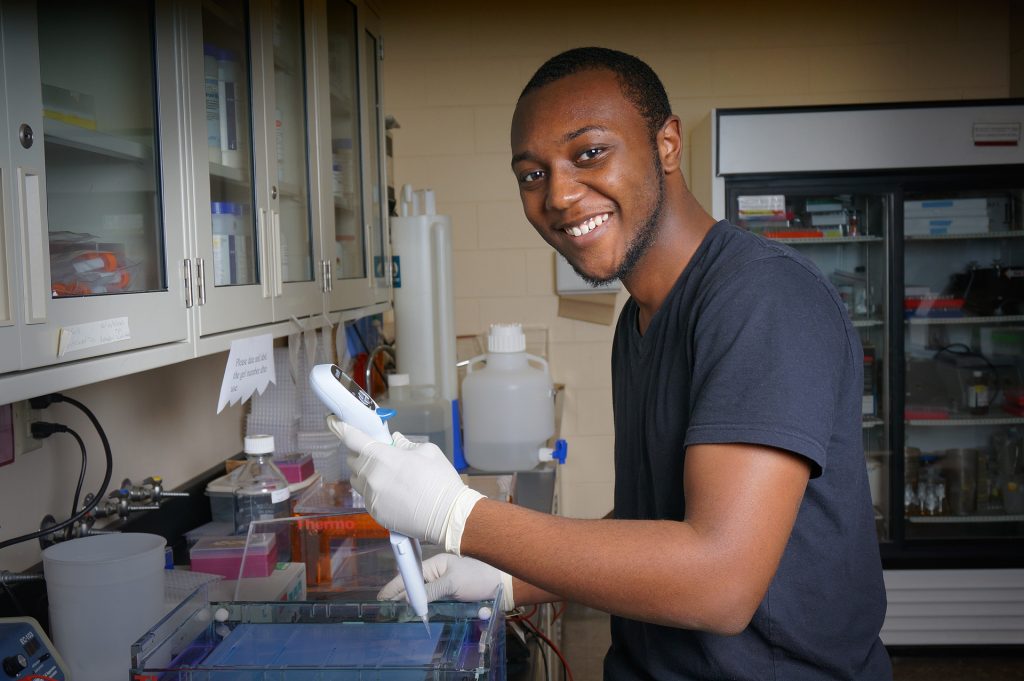 Nigel Golden doing lab work in the College of Natural Resources