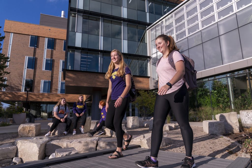 Students walking by the Chemistry Biology Building.