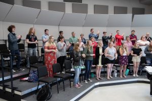A choir practicing during class.