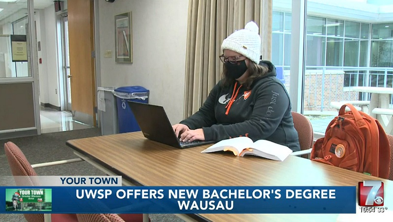 Wausau students studying Sociology on her computer at the Wausau campus.