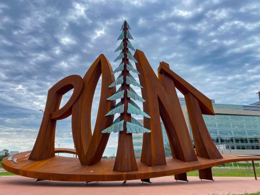 Point art sculpture with pine tree in the middle in Stevens Point.