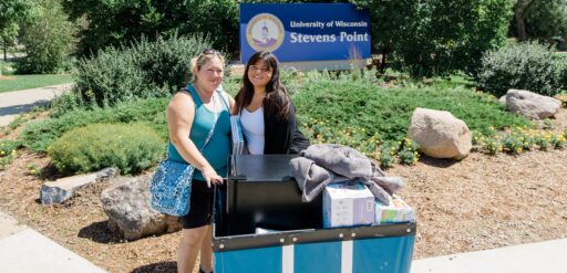 A student moving into the Residence Halls with the help of a family member.