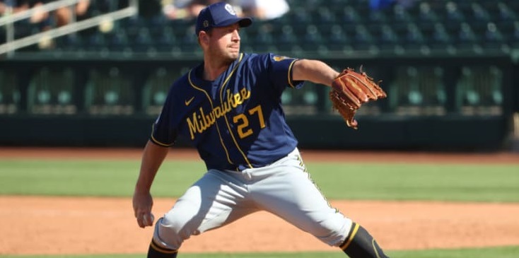 Alumni Jordan Zimmermann throwing a baseball from the pitcher's mound.