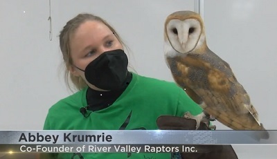 woman holding raptor