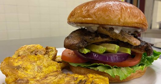 A hamburger with fried chips from Taste of Jamaica.