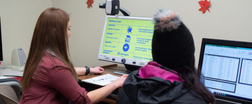 Students using computer technology inside the Disability Resource Center.
