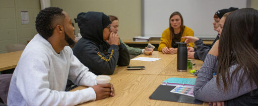 Students gathered around a table.