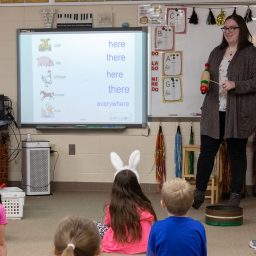 Music education student Kiara Menzia works with local elementary school students