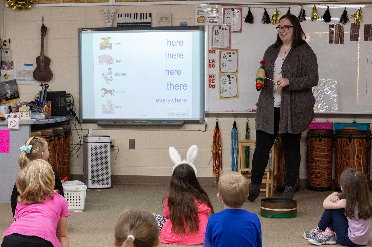 Music education student Kiara Menzia works with local elementary school students
