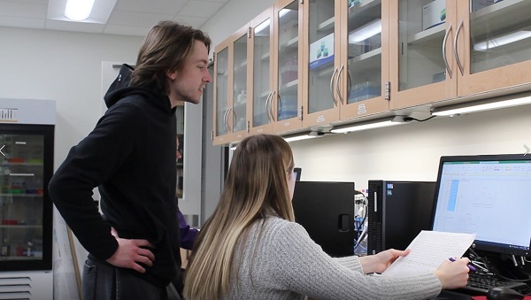 Cody Korth and McKenzi Fernholz are student researchers in Biology Professor Diane Caporale’s lab at UW-Stevens Point, analyzing 20 years of data on ticks.