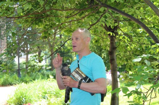 Bob Rosenfield speaking, holding a Cooper's hawk