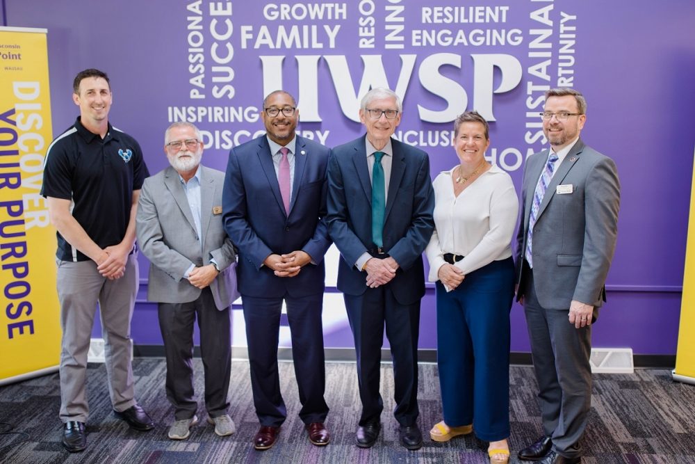 Wisconsin Governor Tony Evers and WEDC Secretary and CEO Missy Hughes stand with UW-Stevens Point Chancellor Thomas Gibson, College of Natural Resources Dean Brian Sloss, and Wisconsin Forestry Center Director Les Werner to announce an $8 million Workforce Innovation Grant supporting forestry workforce development.