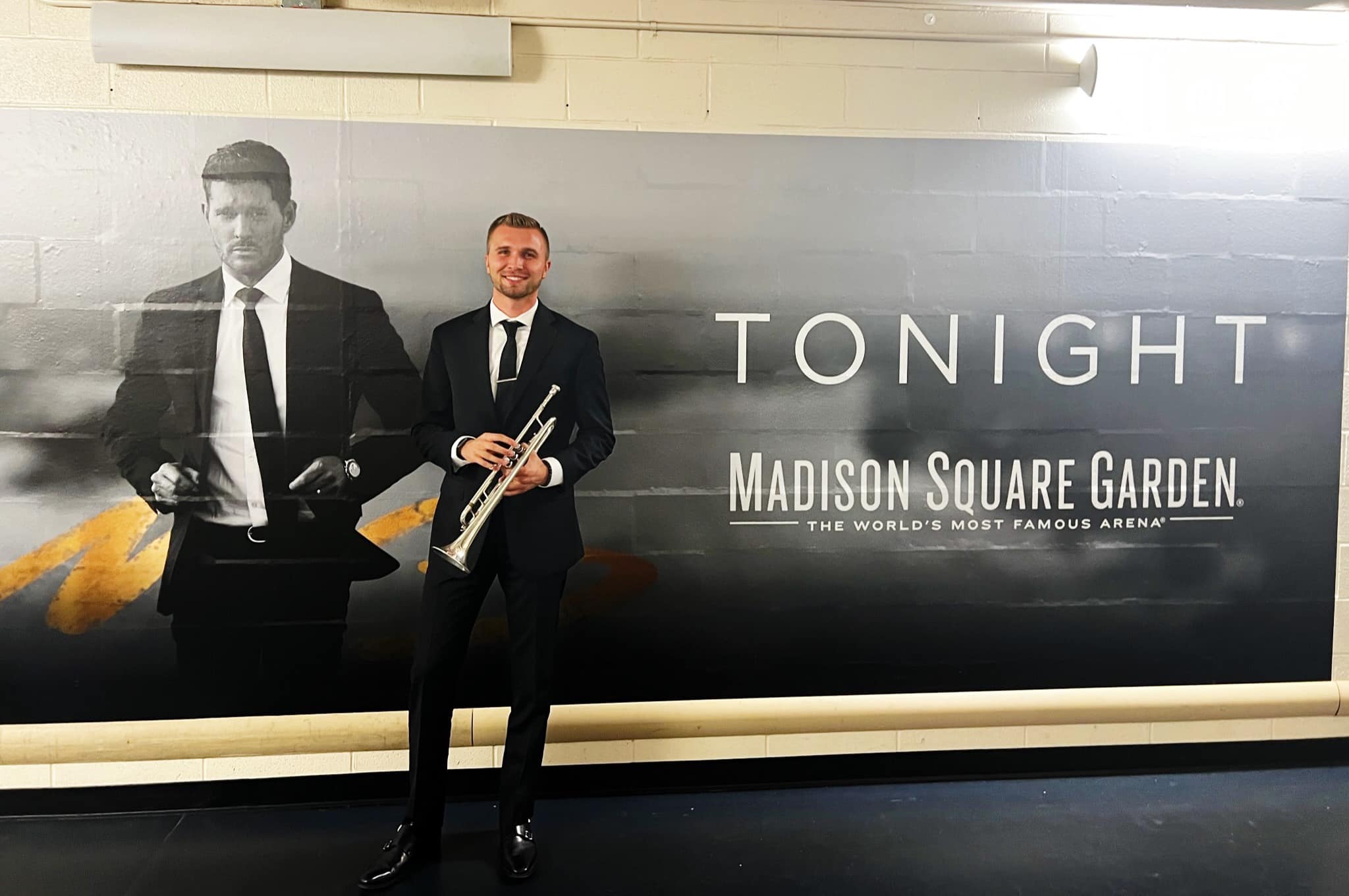 Zachary Finnegan and a poster of Michael Buble