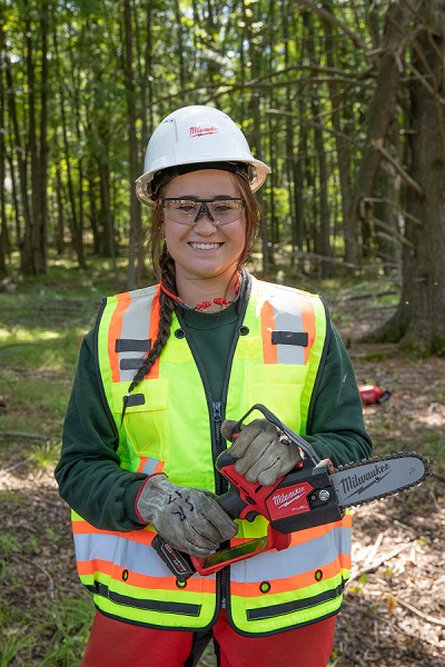 Tess Bigalke, a senior majoring in wildlife ecology, from New Lisbon, demonstrates Milwaukee Tool equipment.