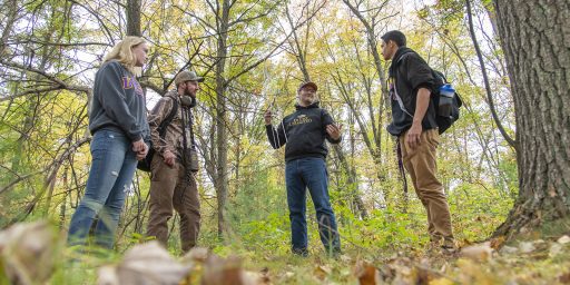 Professor Ben Sedinger teaches students telemetry skills during an outdoor lab.