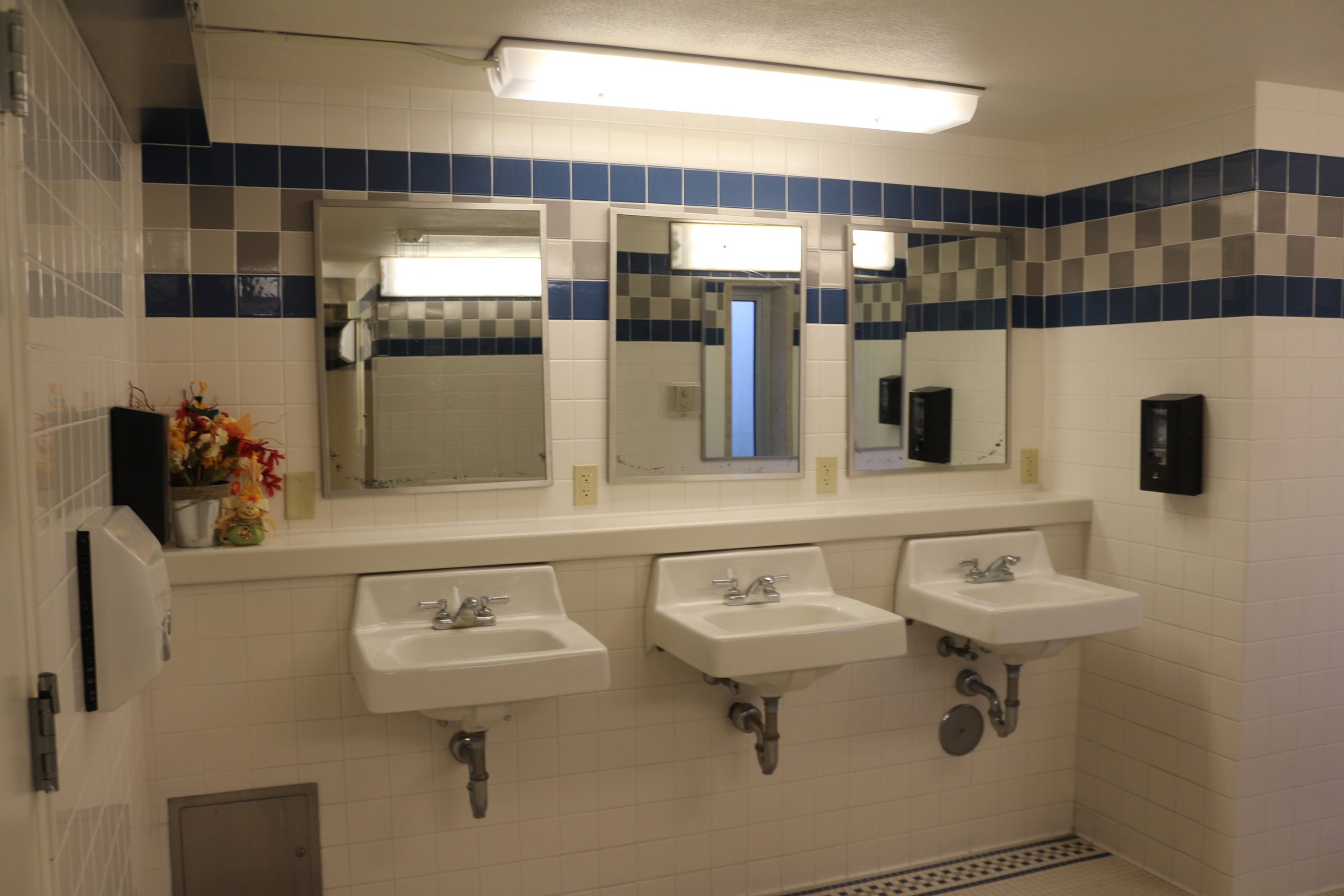 Shared floor bathroom showing three sinks