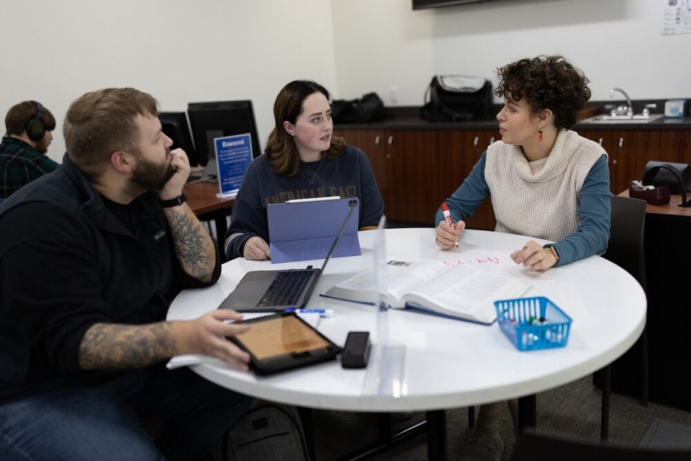 Chloe Gulbronson (right) served as a tutor for chemistry, biology, physics and math and also mentored tutors while pursuing her degree at UW-Stevens Point. Here, she’s with students Mitchell Imlan and Josie Voigt in the Chemistry Biology Building drop-in tutoring lab. 