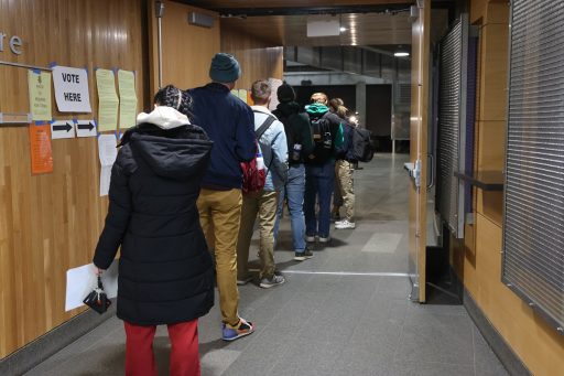 Students line up to vote at UW-Stevens Point’s Dreyfus University Center Encore Room, the polling place for Stevens Point District 3.