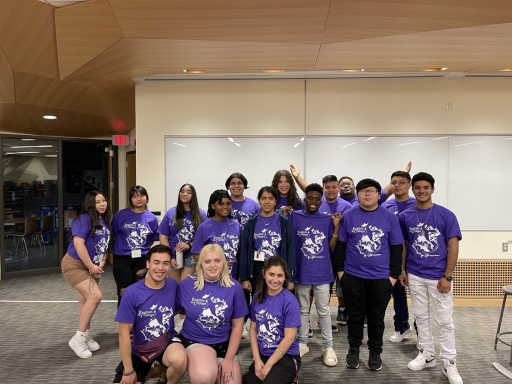 A group of students wearing purple English for College T-shirts.