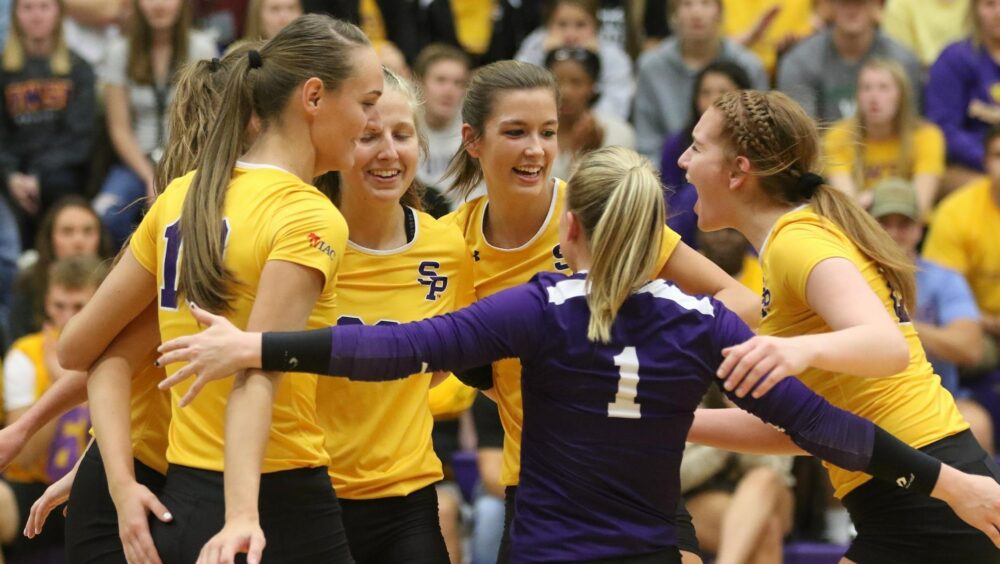 Members of the UWSP Women's Volleyball Team celebrating a score