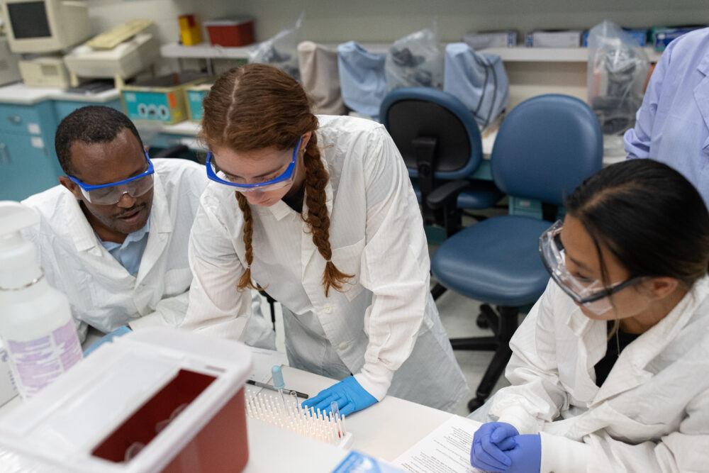 Three UWSP students working in a campus lab