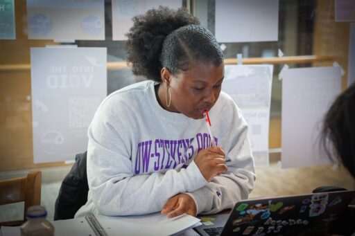 Student Viviane Adadji takes notes in the Multi Cultural Resource Center at UWSP, where courses that focus on critical thinking skills are part of the General Education requirements.