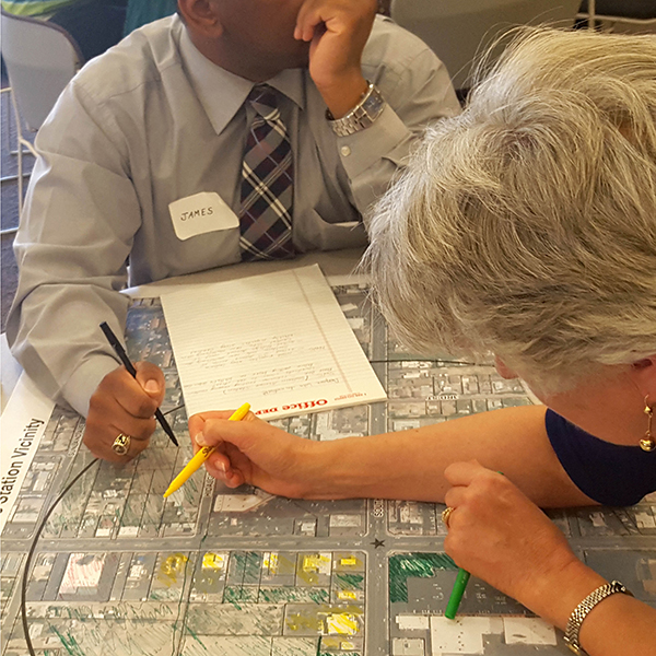 two people with city planning map