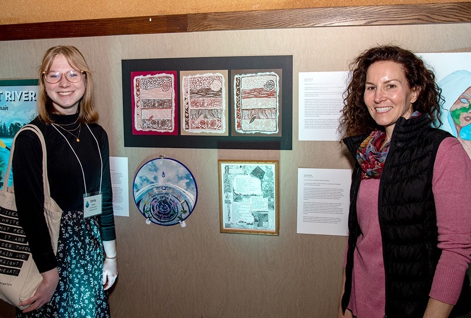 Emily Odegard (left) created this block print of geologic layers after working with Samantha Kaplan, geography/geology professor at UW-Stevens Point. She is one of 31 student artists chosen for The Flow Project that is now on exhibit at the Portage County Library in Stevens Point.