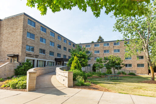 Outside view of Steiner Hall. Brick residence hall.