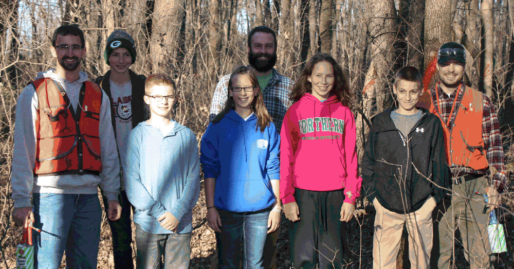 Teachers and students pose in Pulaski School Forest