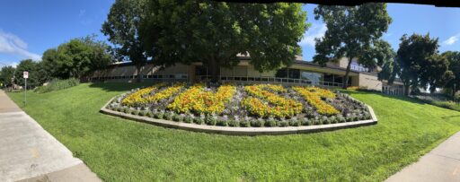 A flowbed that spells the letters of UWSP