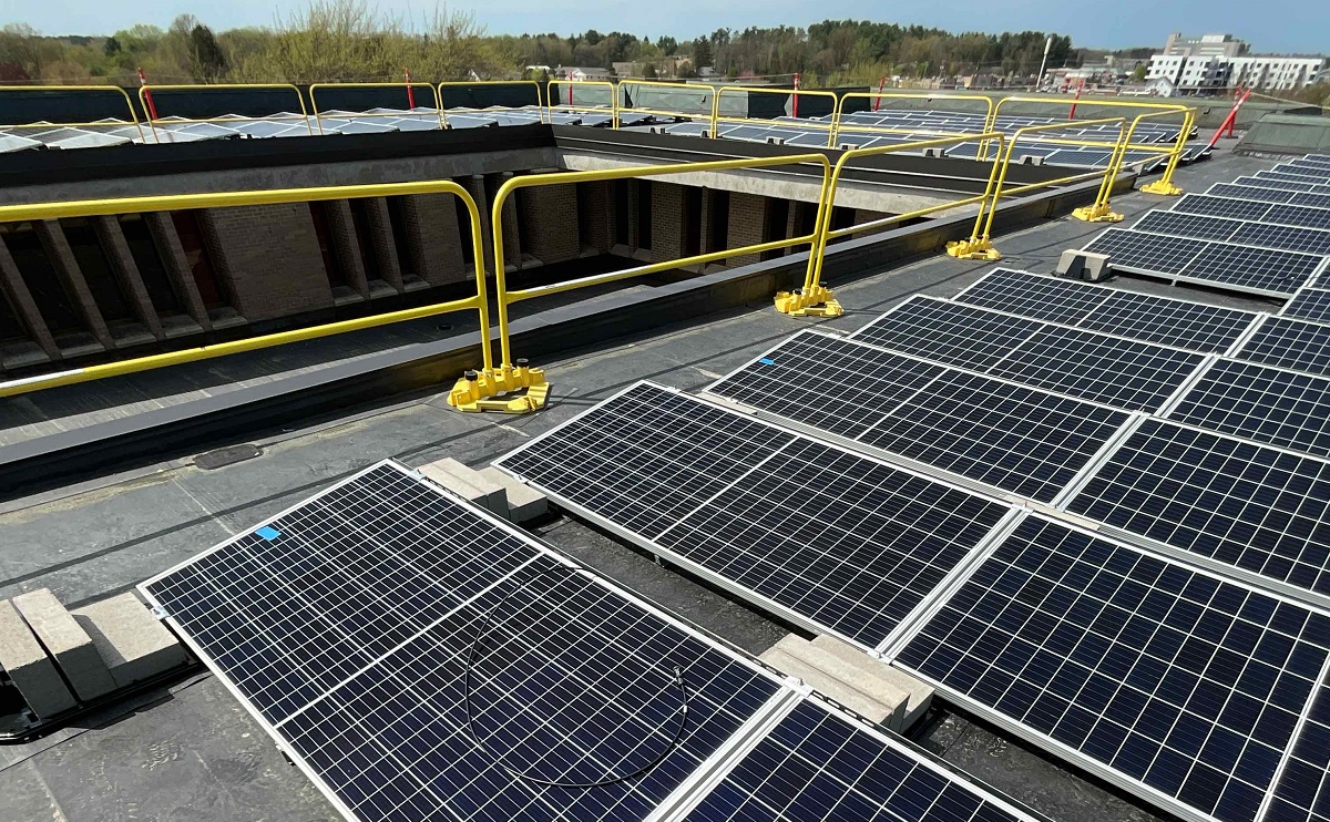 Solar photovoltaic arrays on the roof of the Collins Classroom Center (pictured) and the College of Professional Studies building at UW-Stevens Point, as well as new LED lighting in 15 campus buildings, is helping the university use more renewable energy as well as cut costs.