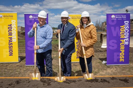 Alumni Breck (left) and Sheri Loos provided a significant gift to support developing a multipurpose sports complex at UW-Stevens Point. They are with Chancellor Thomas Gibson as work begins on the north side of campus.